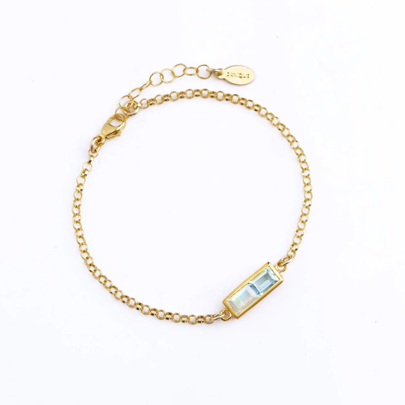 Custom gold multiple baguette birthstone bracelet with four colorful stones, perfect for family jewelry, bridal, or birthday gifts.