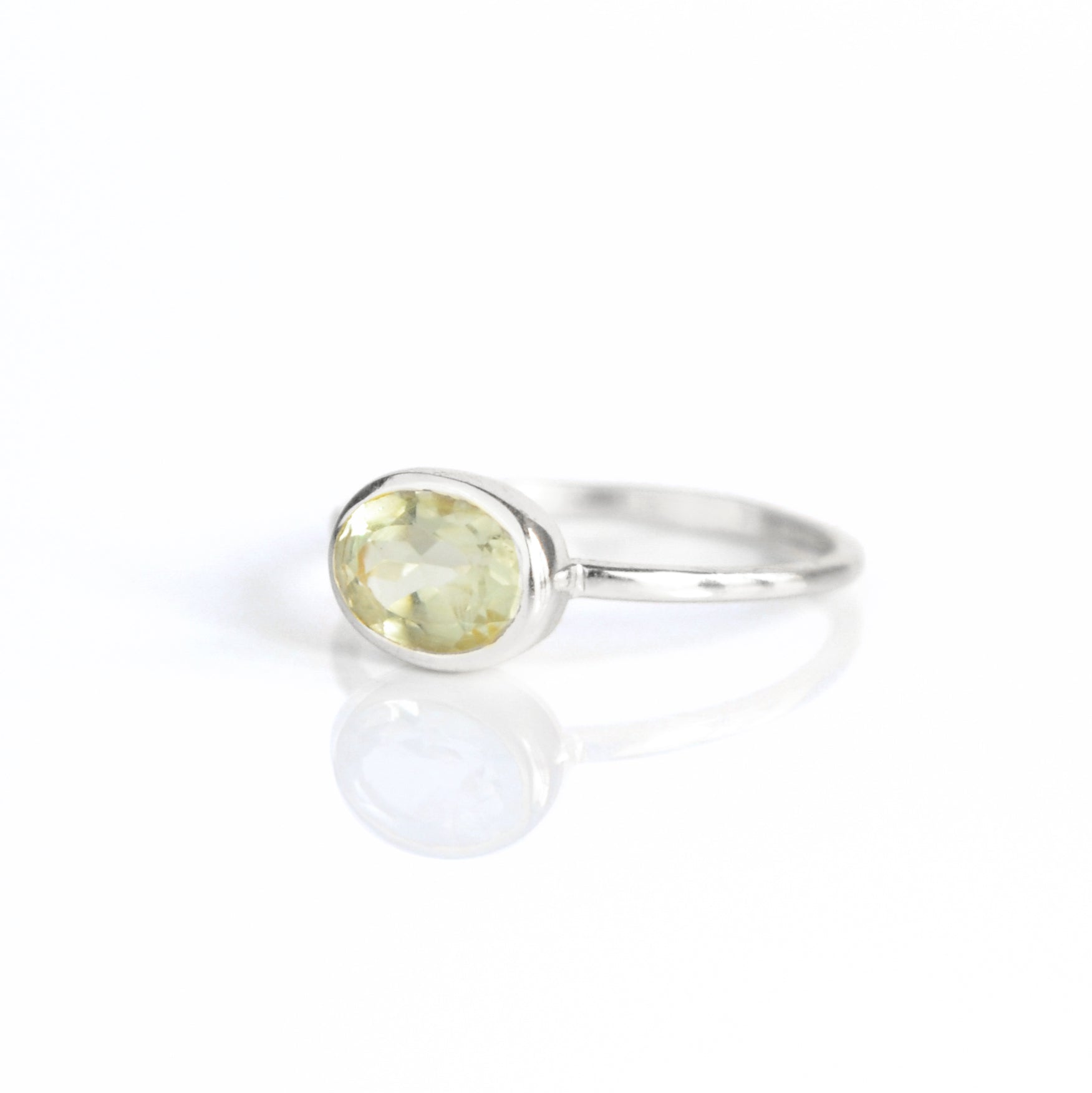 a sterling silver green amethyst ring shown on white background. green gemstone, green birthstone, february birthstone, february gemstone, stack set, stacking rings, gemstone ring, birthstone ring, mother's day gift for her, gift for mom, gift for fiance, gift for girlfriend, wedding jewelry, bridesmaid jewelry, anniversary jewelry, anniversary gift, birthday gift, christmas gift, valentine's day gift, valentine's day rings, dainty ring, cocktail ring, statement ring, bezel set