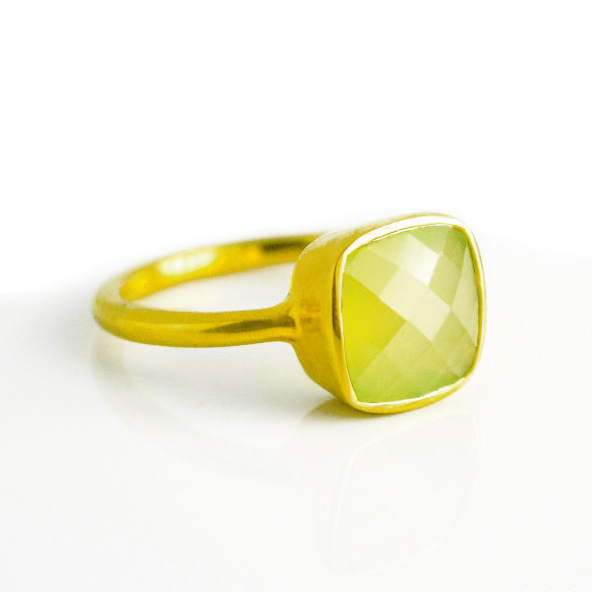 Peridot chalcedony gold plated cushion bezel square stacking ring on white background. August birthday, august gemstone square gemstone, green birthstone, sterling silver ring