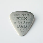 Single guitar pick with couldn't pick a better dad engraving design and stars symbols