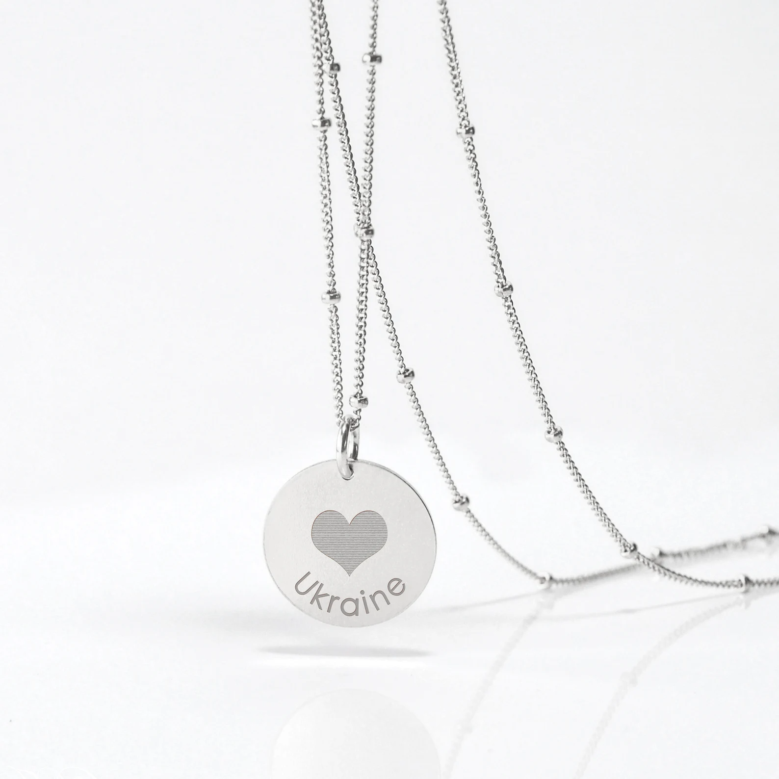 heartukraineIheartukraineIloveukrainefundraiserjewelryukrainesupportnecklacesupportforukrainediscnecklaceprayforukraineengravednecklaceukraineengraveddiskpendantnecklacegoldorsilver.png