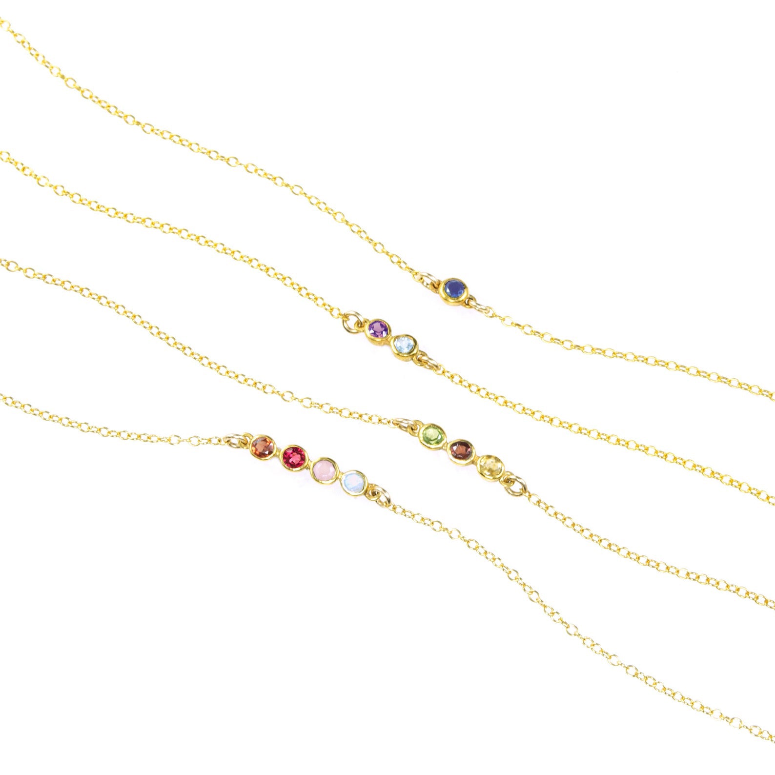 Horizontal minimalist birthstone bar necklaces in sterling silver and gold, featuring up to six gemstones representing family members or loved ones. This dainty bar pendant design is perfect for everyday layering or gifting as a meaningful Mother’s Day necklace, birthday present for mom, or anniversary keepsake. Customizable with personalized birthstones in all months, this elegant jewelry piece makes a timeless heirloom for women who love minimal and modern style.