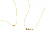 One gold filled black onyx birthstone connector necklace. One four stone dainty birthstone necklace featuring garnet, ruby, pink chalcedony and aqua chalcedony. 