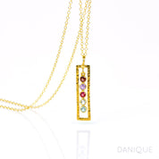Single gold filled open frame necklace featuring 5 birthstones including garnet, purple amethyst, ruby, green amethyst and blue topaz. 