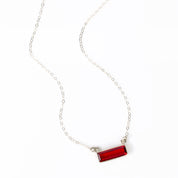 Single sterling silver cable chain vertical garnet quartz january birthstone adira bar necklace on white background, gemstone adira bar connectors. birthstone jewelry, birth month jewelry, birthstone necklace, jewelry gift, necklace gift for her, anniversary gift, christmas gift, valentine's day gift, wedding jewelry, bridesmaid's jewelry, gift for mom, gift for wife, gift for girlfriend, gift for grandma, mother's day gift