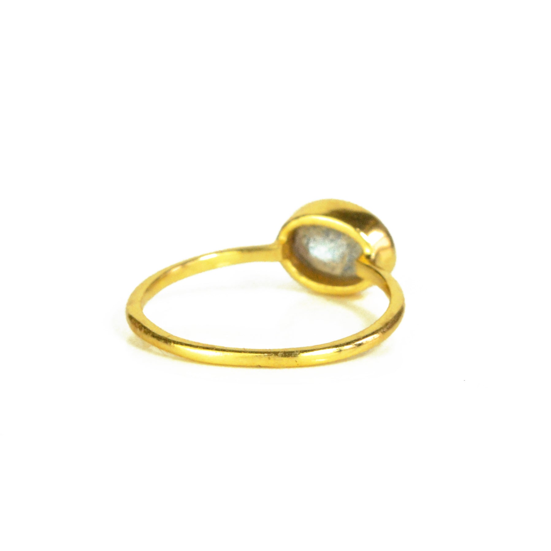 a rear view of the gold labradorite ring shown on white background. stackable! Stacking rings, bezel set, small oval, tiny oval, dainty oval, birthstone rings, sterling silver stamp, birthstone ring, birthstone jewelry, iridescent gemstone, gray birthstone