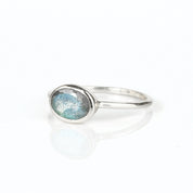 a sterling silver labradorite ring shown on white background. stackable! Stacking rings, bezel set, small oval, tiny oval, dainty oval, birthstone rings, sterling silver stamp, birthstone ring, birthstone jewelry, iridescent gemstone, gray birthstone