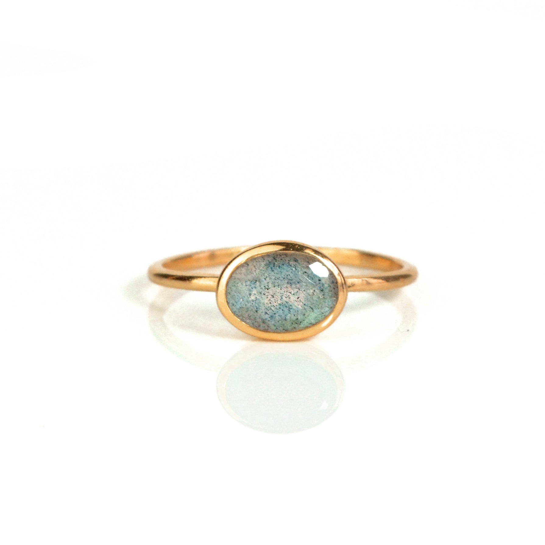 a rose gold labradorite ring shown on white background. stackable! Stacking rings, bezel set, small oval, tiny oval, dainty oval, birthstone rings, sterling silver stamp, birthstone ring, birthstone jewelry, iridescent gemstone, gray birthstone
