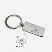 Single keychain with child's drawing engraved into the front.