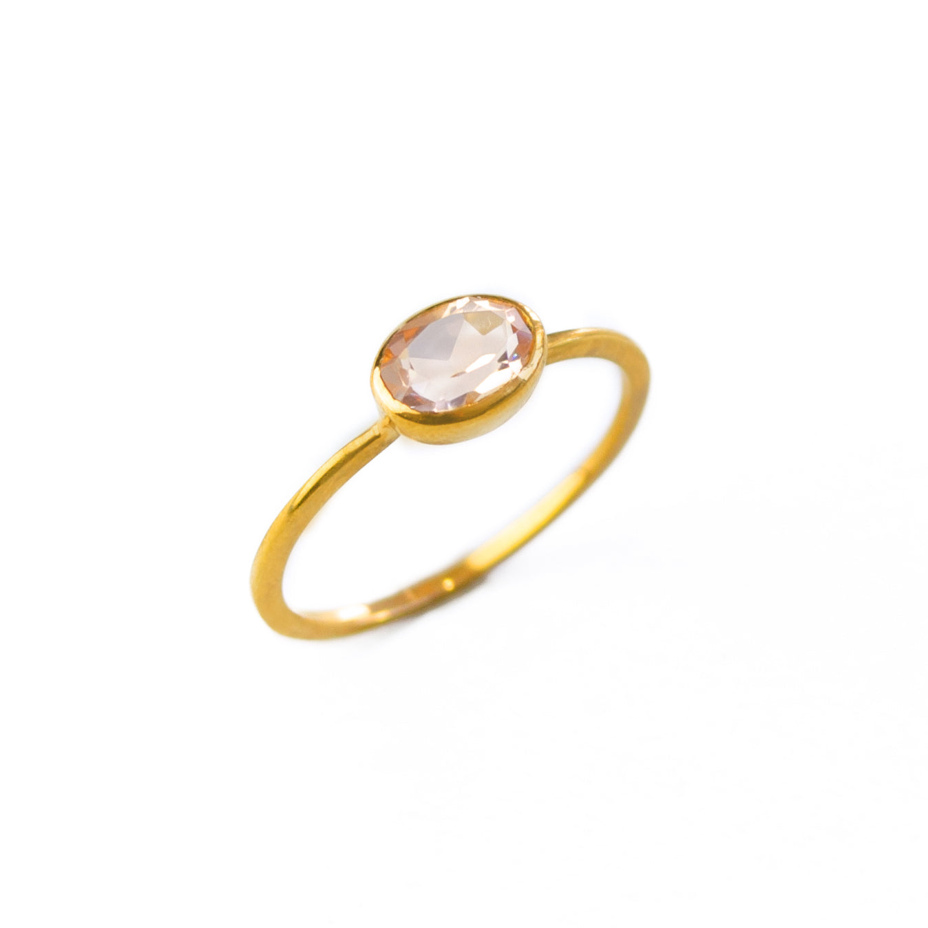 a gold morganite ring shown on white background. stackable! Stacking rings, bezel set, small oval, tiny oval, dainty oval, birthstone rings, sterling silver stamp, birthstone ring, birthstone jewelry, stack set, stacking rings, gemstone ring, birthstone ring, mother's day gift for her, gift for mom, gift for fiance, gift for girlfriend, wedding jewelry, bridesmaid jewelry, anniversary jewelry, anniversary gift, birthday gift, christmas gift, valentine's day gift, valentine's day rings, cocktail ring