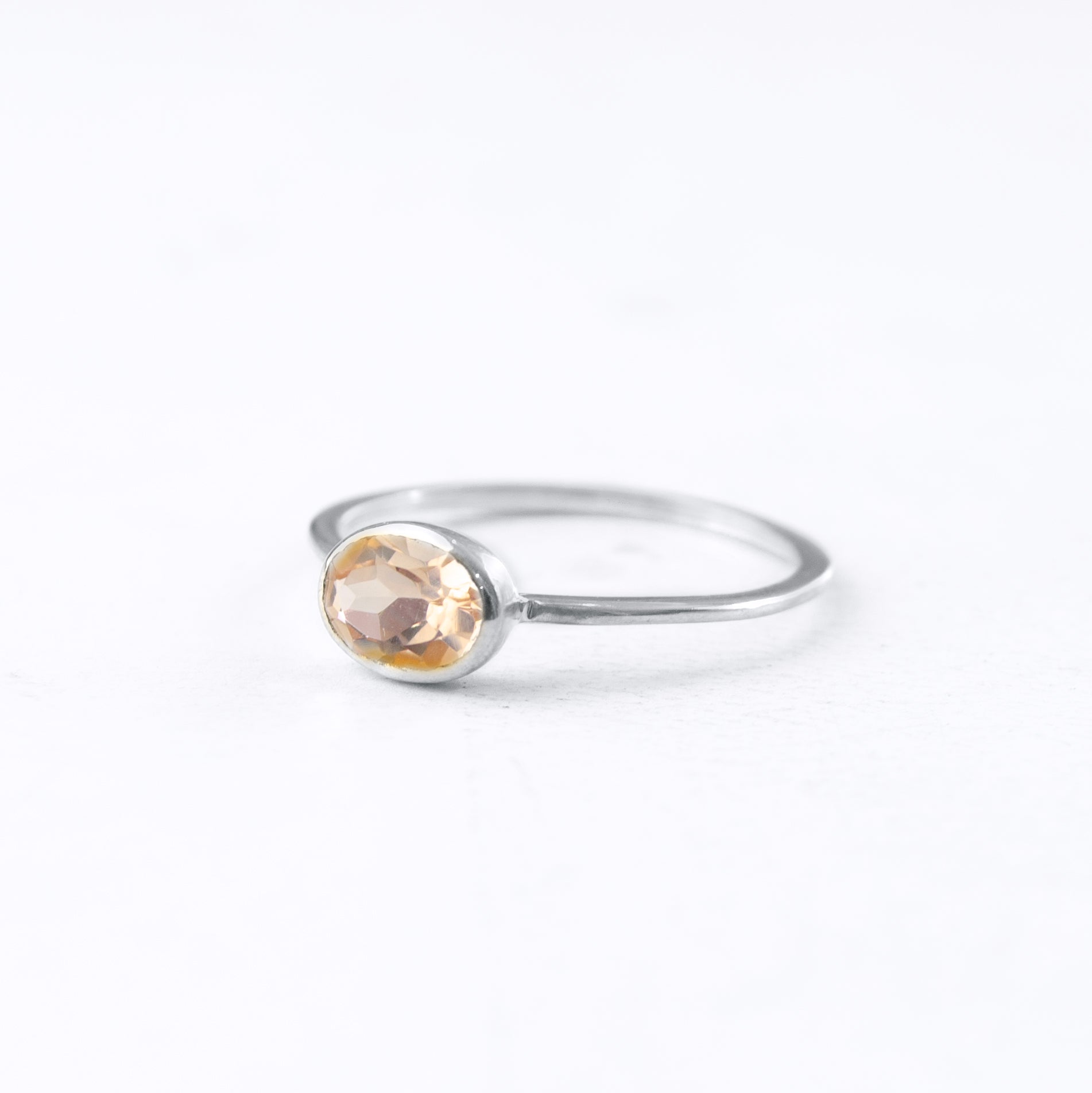sterling silver morganite ring shown on white background. stackable! Stacking rings, bezel set, small oval, tiny oval, dainty oval, birthstone rings, sterling silver stamp, birthstone ring, birthstone jewelry, stack set, stacking rings, gemstone ring, birthstone ring, mother's day gift for her, gift for mom, gift for fiance, gift for girlfriend, wedding jewelry, bridesmaid jewelry, anniversary jewelry, anniversary gift, birthday gift, christmas gift, valentine's day gift, valentine's day rings, dainty ring