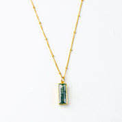Single gold filled satellite chain with vertical moss agate adira bar necklace on white background