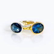 Mix-and-match oval birthstone rings sizing and color chart showing available gemstones and metals; build your own stack with kyanite (September) plus garnet, amethyst, aquamarine, citrine, peridot and more; choose sterling silver or 18k gold vermeil.