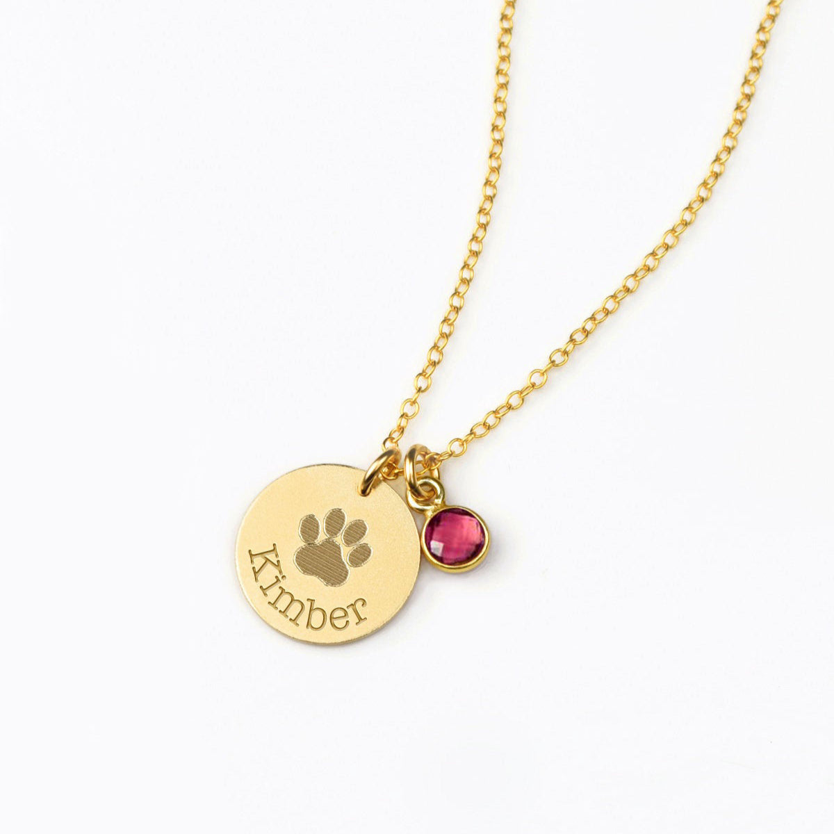 Custom paw print necklace with engraved pet name and sparkling birthstone charm, handcrafted in sterling silver, gold, or rose gold. A meaningful pet memorial necklace or Christmas gift for dog moms, cat moms, and animal lovers. Personalizable with all 12 monthly birthstones from January garnet to December turquoise. Elegant keepsake jewelry gift for birthdays, anniversaries, Mother’s Day, or remembrance occasions.