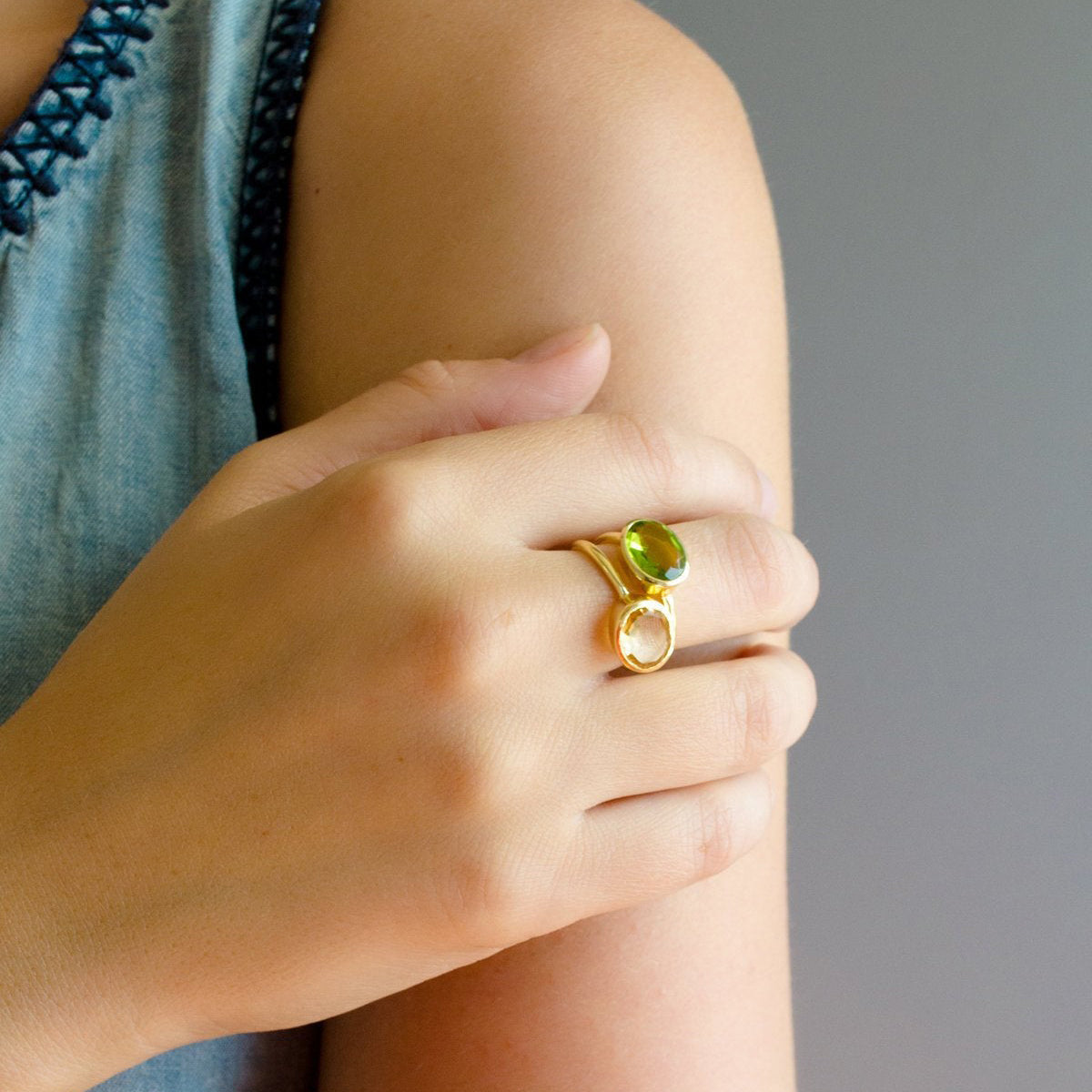Model in blue top is stacking the oval citrine and peridot rings. Citrine jewelry, Oval yellow gemstone ring, November birthstone, Citrine, Bezel set oval ring, 18k gold vermeil, Sterling silver Topaz ring, Light yellow ring, Gift for her, Topaz Quartz ring