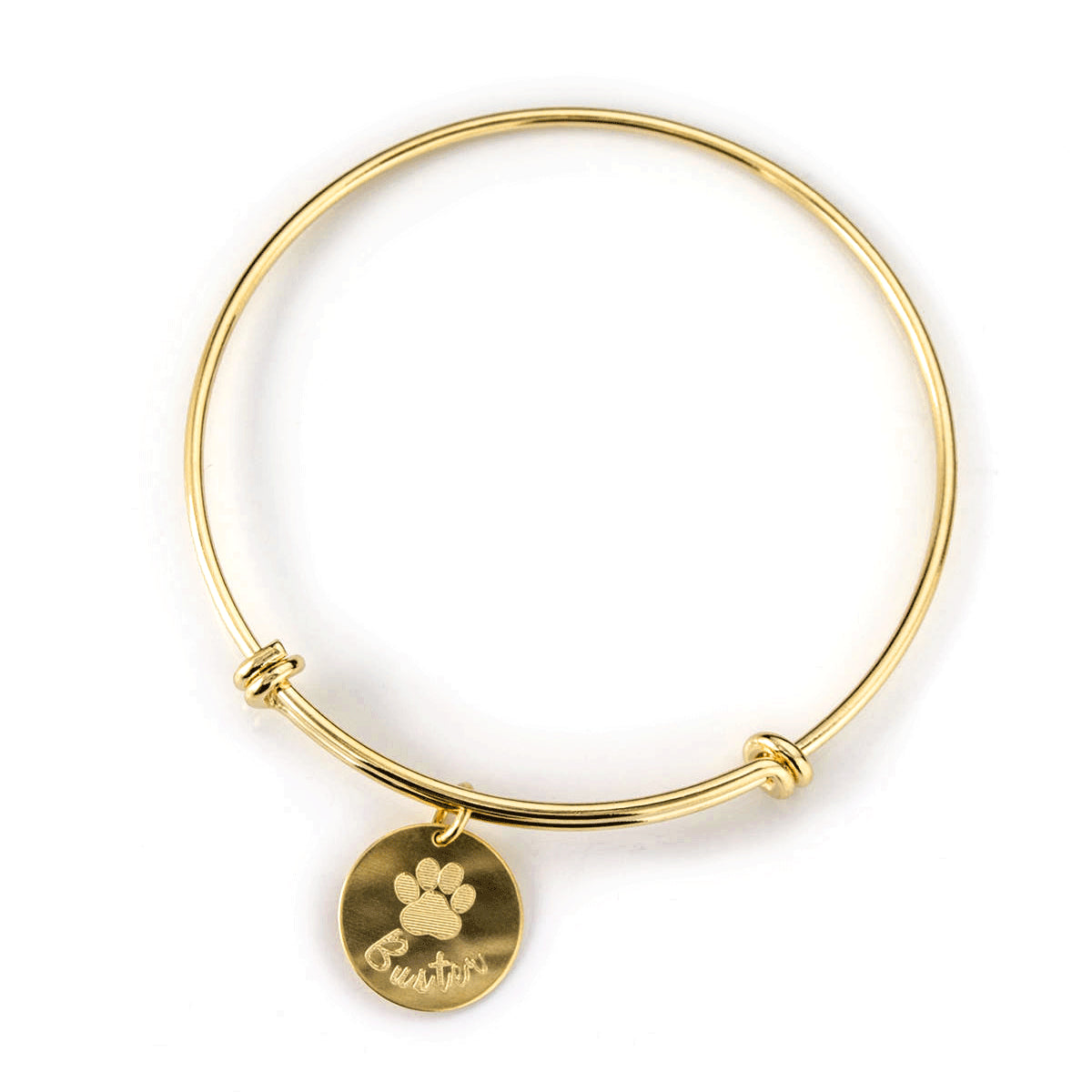 Gold plated bangle with engraved disc charm and name in script font.