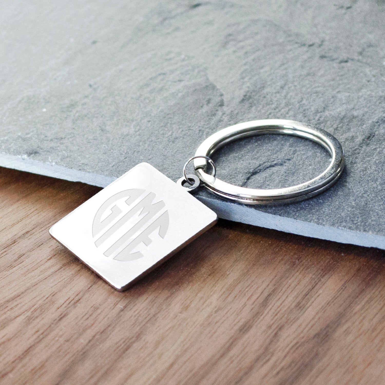 Silver Stainless Steel Square Shape Keychain Engraved with a rounded Custom Monogram. Personalize a keychain with a custom monogram, custom text, or custom image such as baby handprints or a child's drawing.