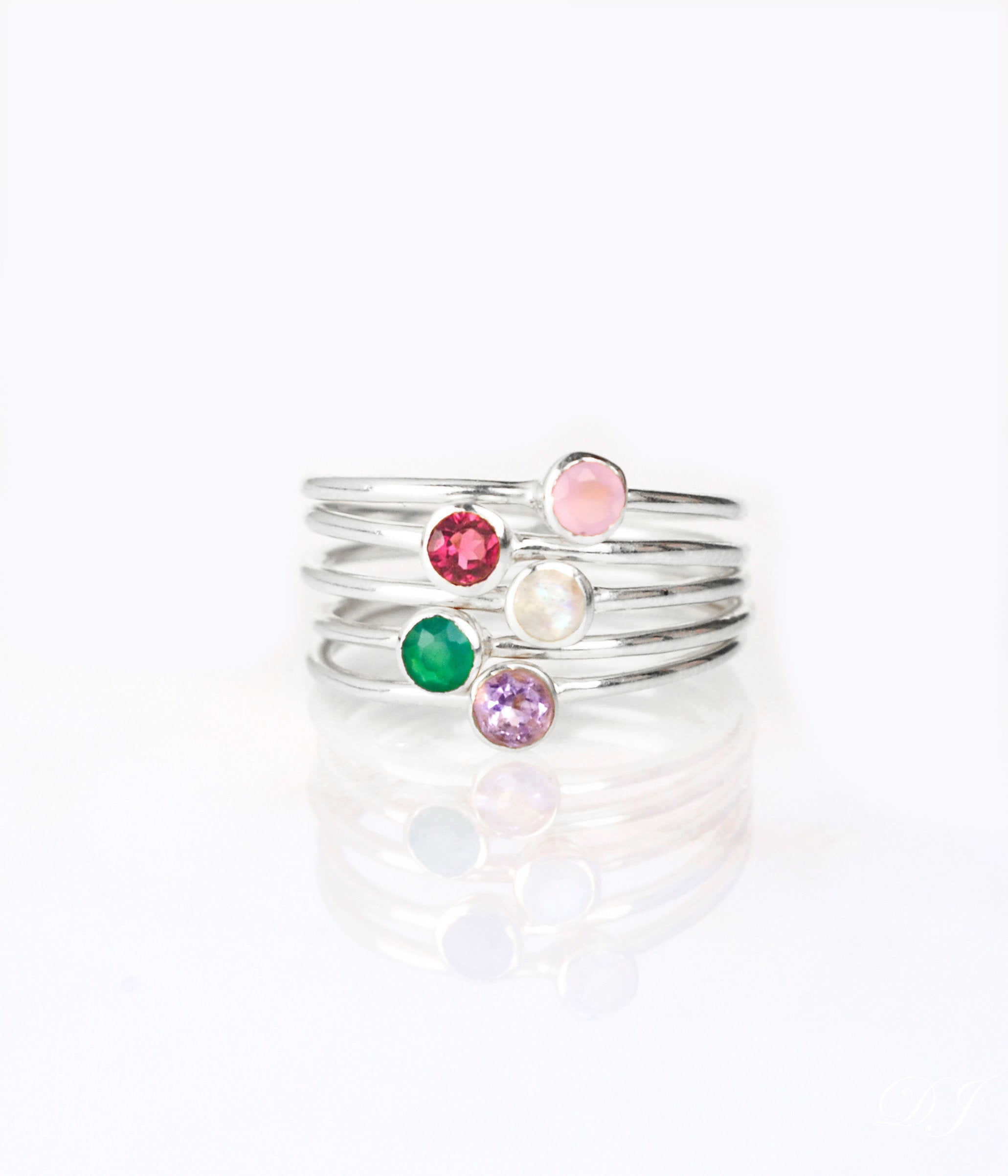 set of 5 sterling silver dainty 3mm gemstone rings featuring pink chalcedony, ruby, moonstone, green onyx and purple amethyst. July  birthstone. On white background. 925 sterling silver, birthstone ring, stacking ring, stackable, birthstone jewelry, facet gemstone