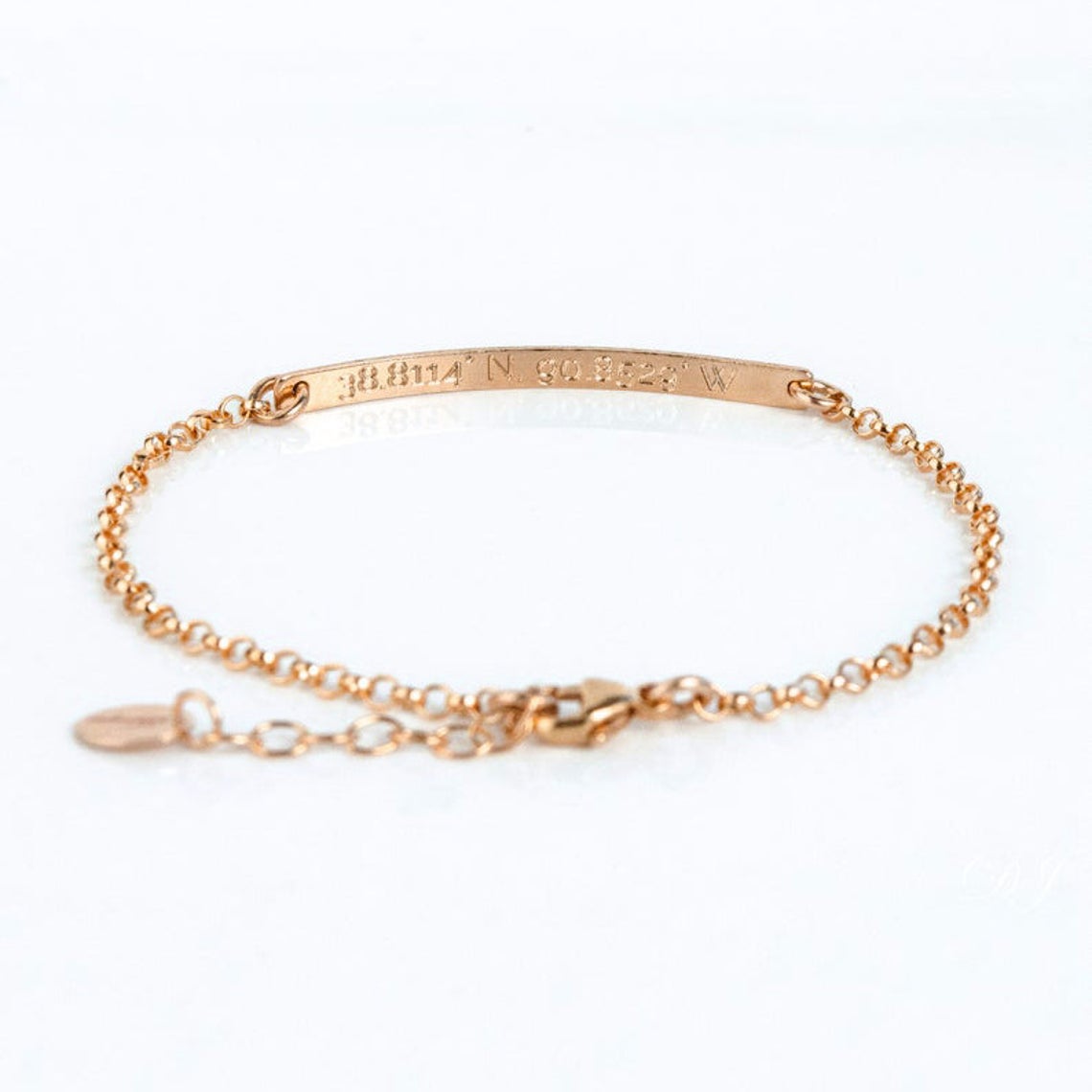 Single rose gold filled skinny bar anklet with morse code on the front and secret coordinates engraved on the back.