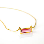 Single gold filled cable chain with ruby quartz horizontal bar adira necklace july birthstone on white background
