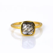 Black Rutilated Quartz gold plated cushion bezel square stacking ring on white background. black gemstone, square gemstone, rutile stone, sterling silver ring