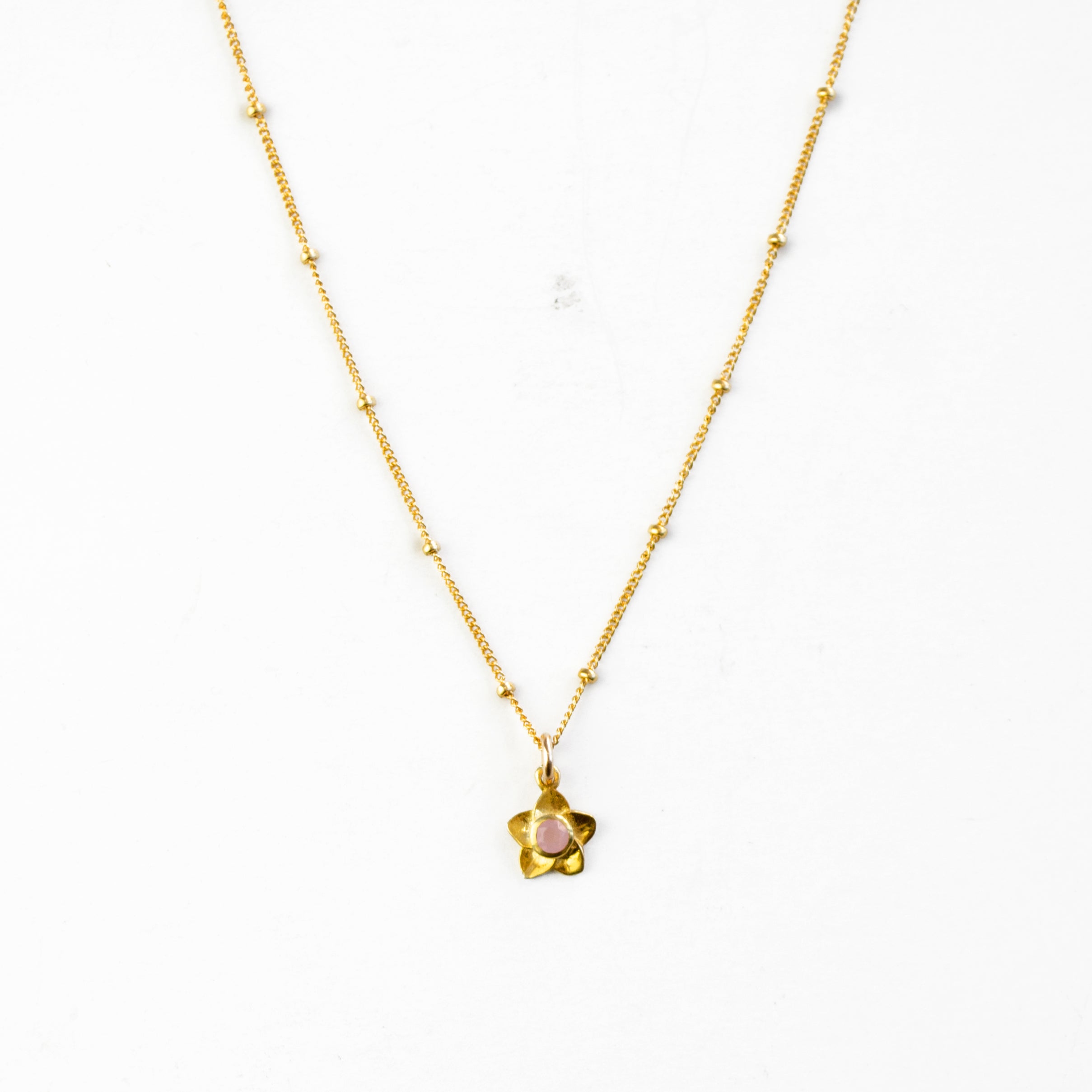 Single gold filled satellite chain daughter's bloom necklace with pink chalcedony birthstone on a white background. Mother daughter necklace set. 