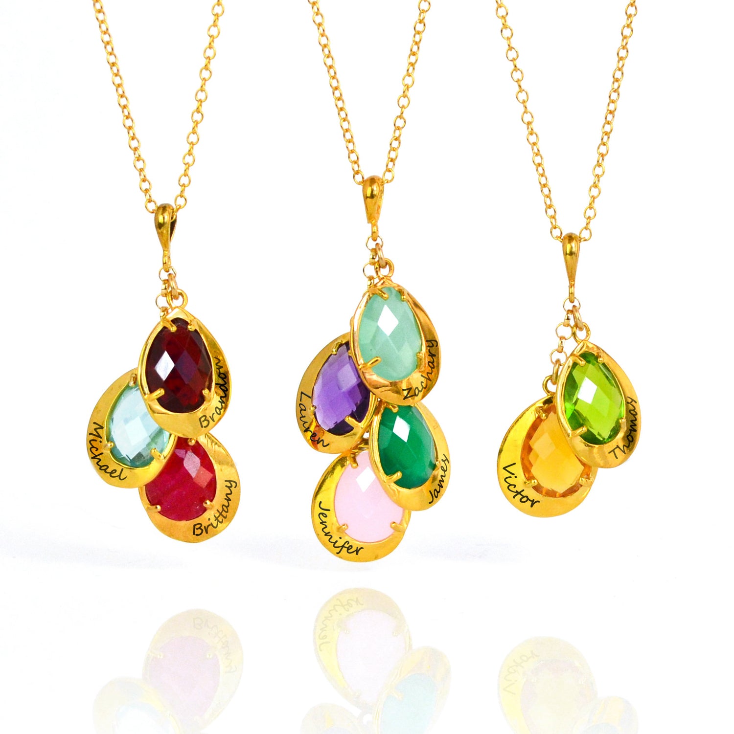 Three gold filled cable chain mothers necklaces shown first featuring garnet, blue quartz, and ruby, center featuring aqua chalcedony, purple amethyst, green onyx and pink chalcedony, last featuring peridot and citrine all with names engraved. 
