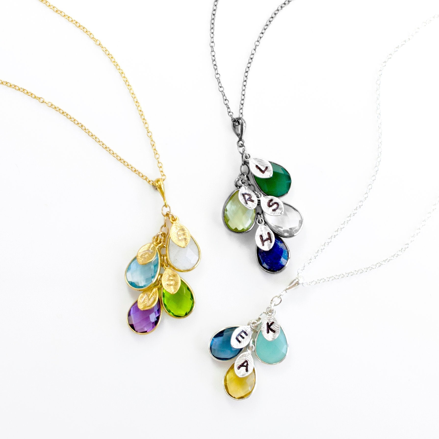 Mother's Day Gift for Mom: Birthstone Initial Cascade Necklace One gold filled necklace with opal, blue topaze, peridot and purple amethyst, one blackened silver with green onyx, green amethyst, clear quartz and kyanite, once silver necklace with aqua chalcedony, kyanite, and citrine all with hand stamped initials
