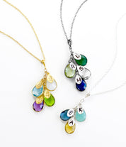 Mother's Day Gift for Mom: Birthstone Initial Cascade Necklace One gold filled necklace with opal, blue topaze, peridot and purple amethyst, one blackened silver with green onyx, green amethyst, clear quartz and kyanite, once silver necklace with aqua chalcedony, kyanite, and citrine all with hand stamped initials