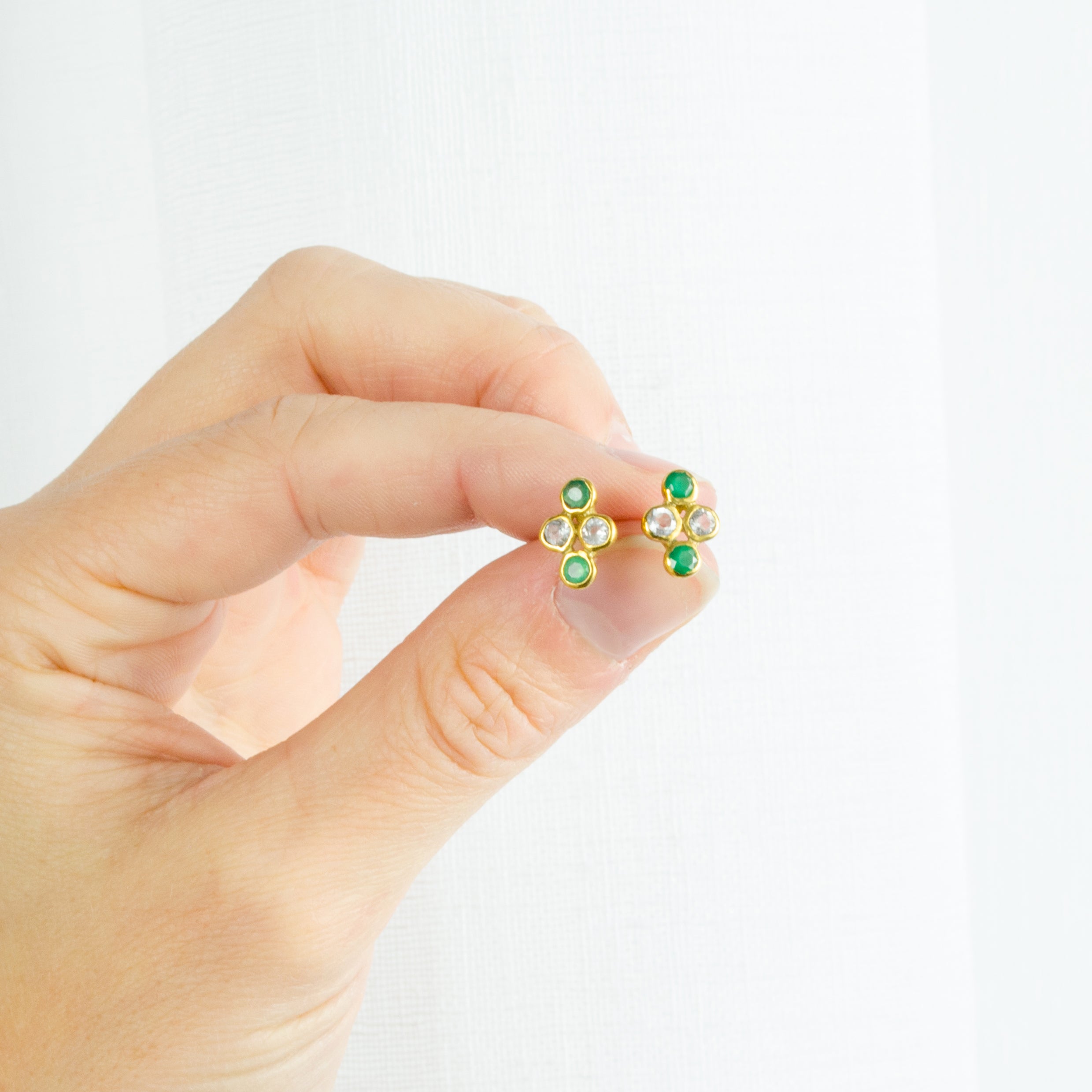 https://www.daniquejewelry.com/cdn/shop/products/tiny_3mm_stud_4_stones_earrings-0008.jpg?v=1618410165