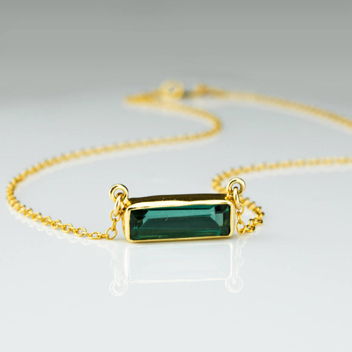Single gold filled cable chain horizontal Green Tourmaline adira bar necklace october birthstone on white background