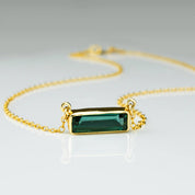 Single gold filled cable chain horizontal Green Tourmaline adira bar necklace october birthstone on white background