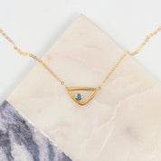 Single gold filled triangle geometric necklace with kyanite birthstone for september. 