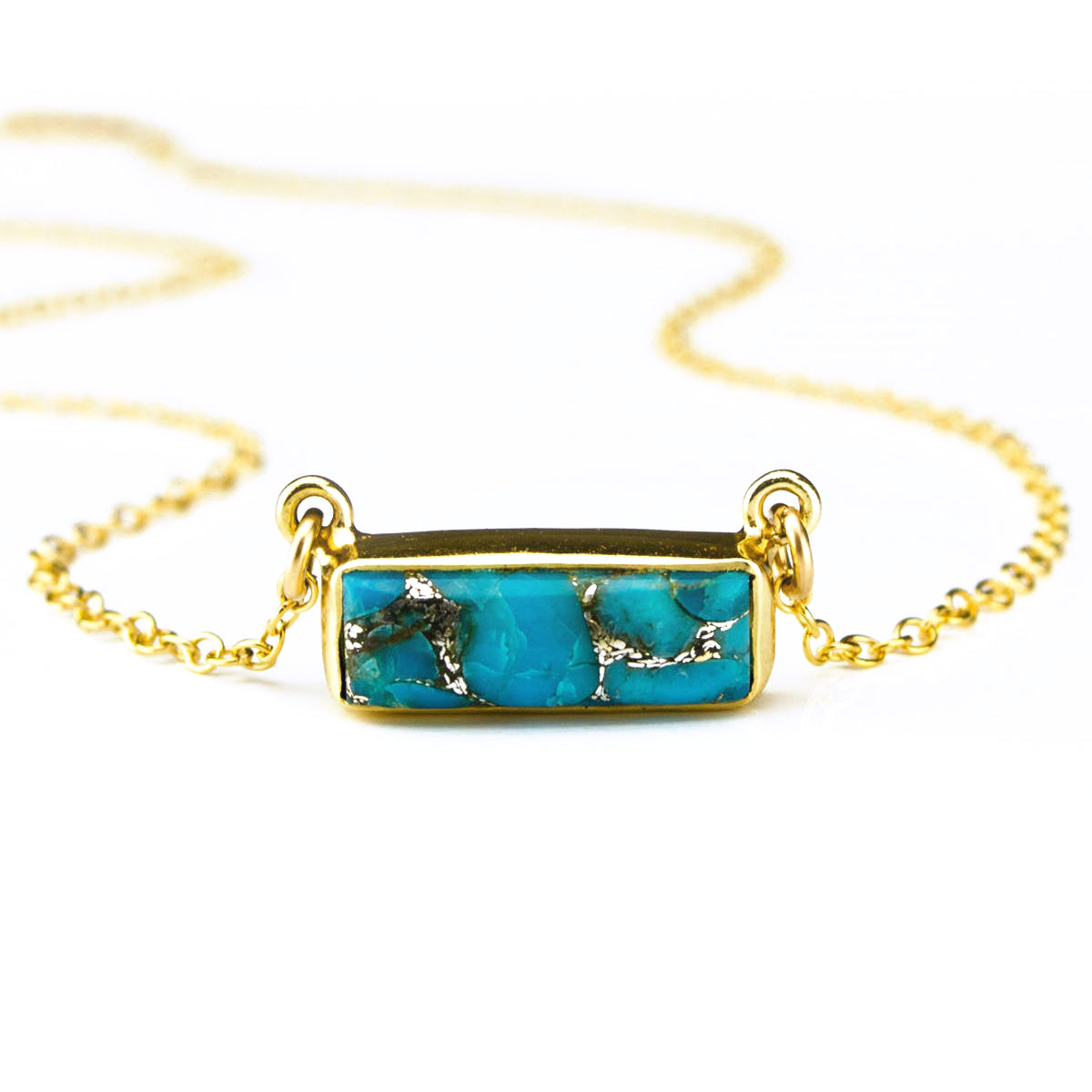 Single gold filled cable chain copper turquoise horizontal adira bar necklace with white background. december birthstone