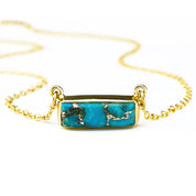 Single gold filled cable chain copper turquoise horizontal adira bar necklace with white background. december birthstone