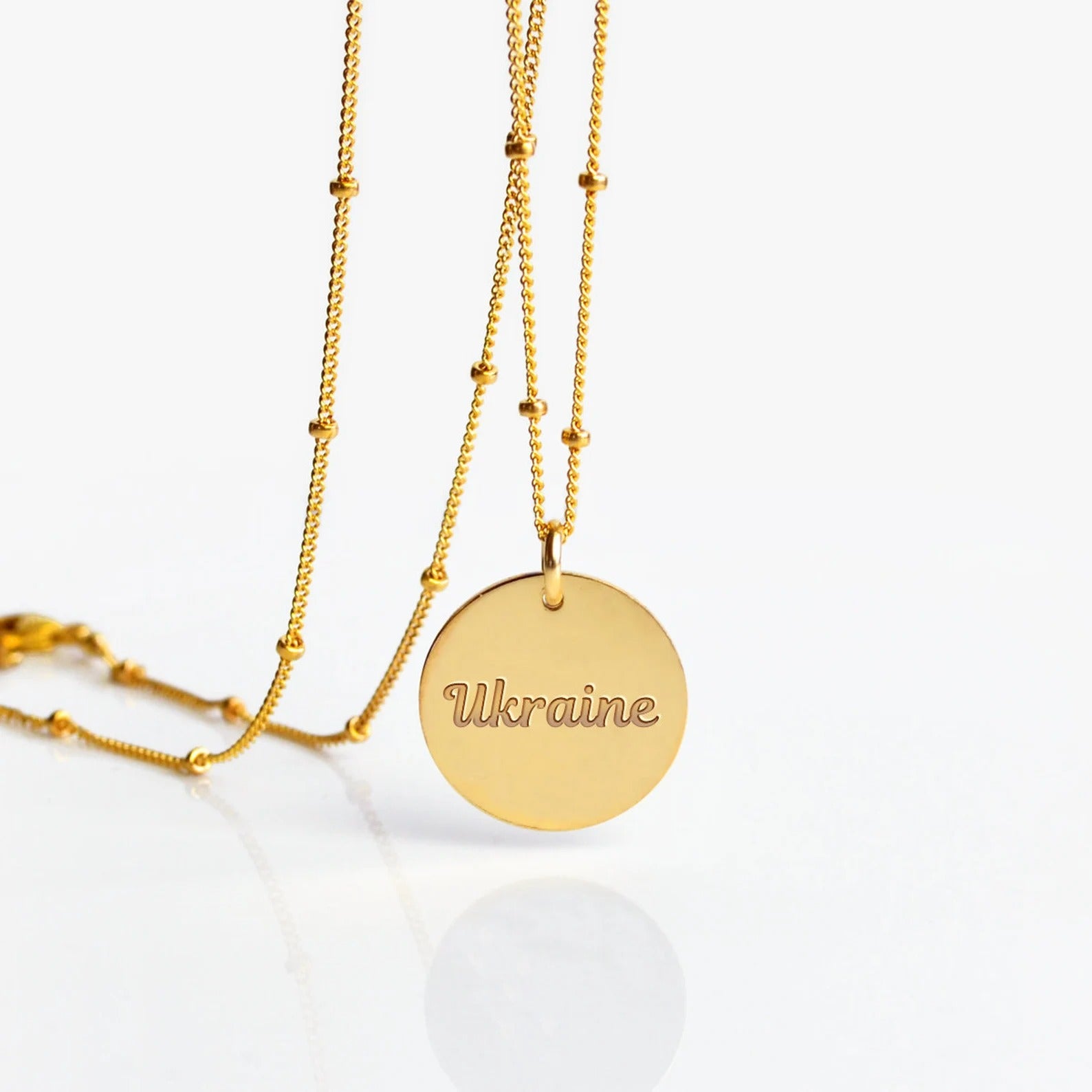 ukrainetextengravingsupportforukrainetextnecklacesupportforukrainefundraiserdiscnecklacegold-fillednecklaceprayforukrainejewelry.jpg
