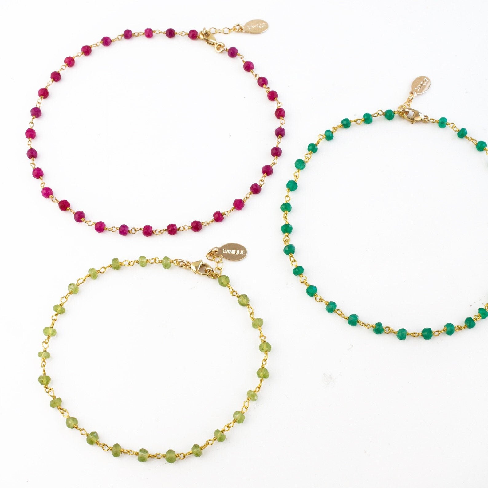 Trio of gold filled wire wrapped anklets with peridot, green onyx and ruby stones. 