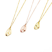 Butterfly pendant wing birthstone necklace in gold plated with satellite chain and purple amethyst 3mm birthstone; center is a rose gold necklace with cable chain featuring ruby and garnet gemstones, third is a gold plated butterfly wing with aqua chalcedony, pink chalcedony and moonstone birthstones. Birthstone necklace, birthstone jewelry, sterling silver, dainty gemstones
